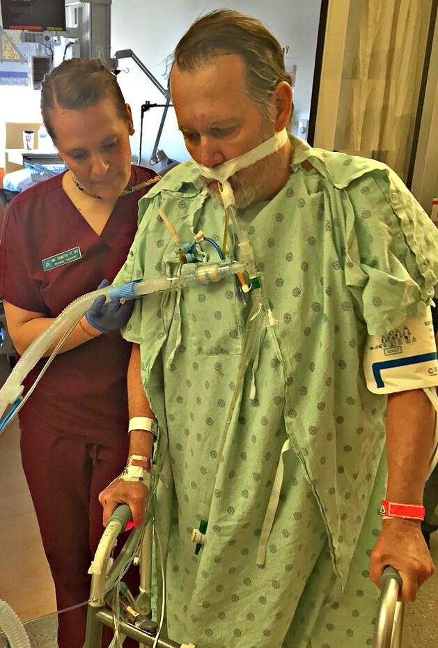 Assisting patient - ICU Physical Medicine and Rehabilitation