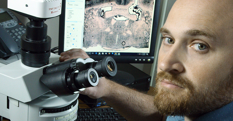 researcher with microscope