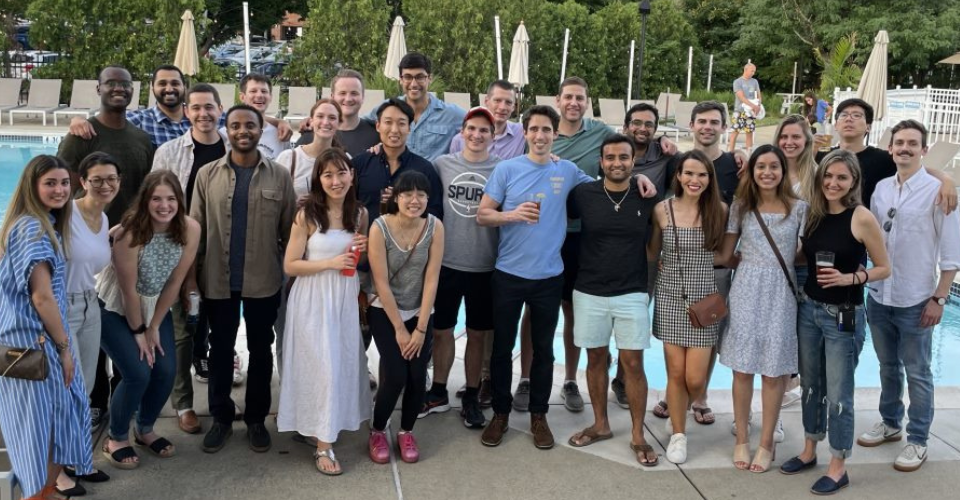 group of residents at an outside restaurant smiling