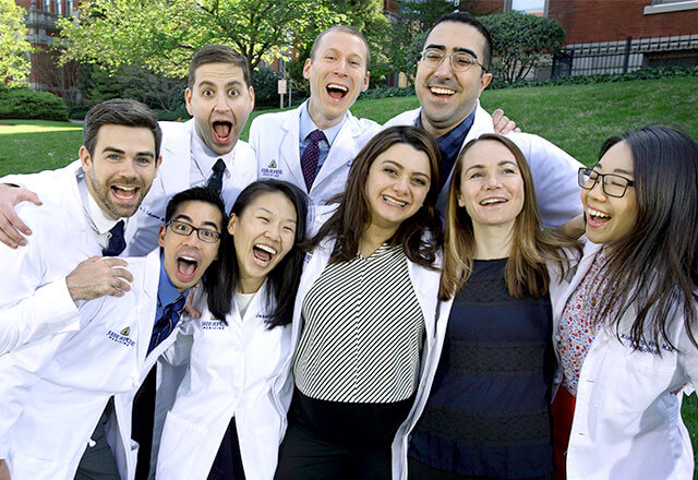 residents pose outside