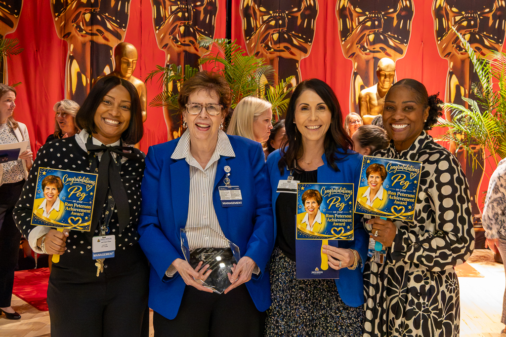 In attendance to celebrate (second from left) Peg were (from left) LaKiesha Brown, assistant director at JHMI Green Spring Station; Danielle Karavedes, chief administrative officer of Radiology; and Teri McClary, assistant director at JHMI Bethesda