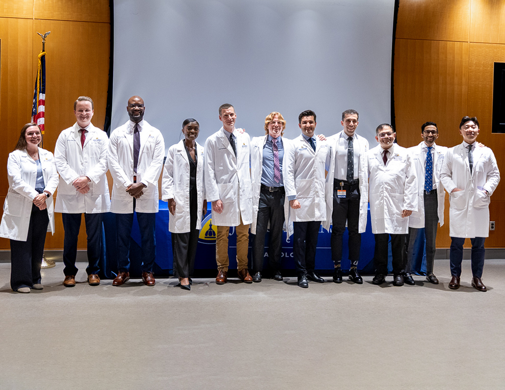 The recent graduates posing with faculty