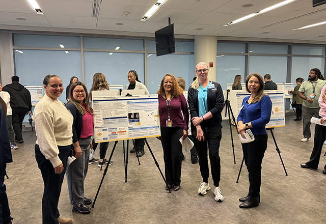 students showing their posters