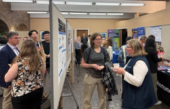 Radiology researchers showing posters