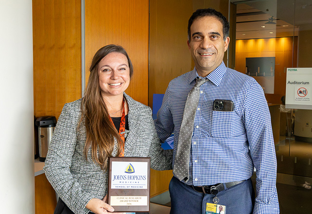 Dr. Shadpour Demehri presented a clinical research award to Dr. Erin Gomez.