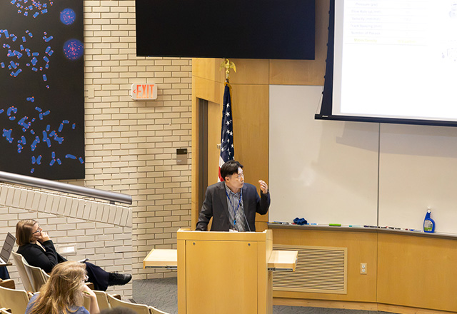 researchers talking at a table
