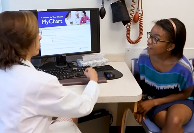 A girl talking to her doctor