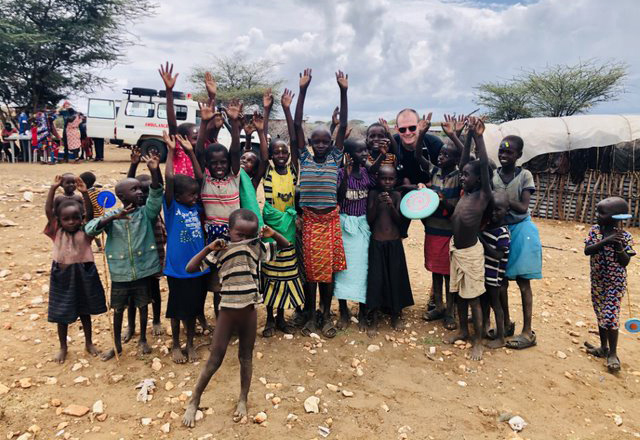 global health residents with Kenyan villagers