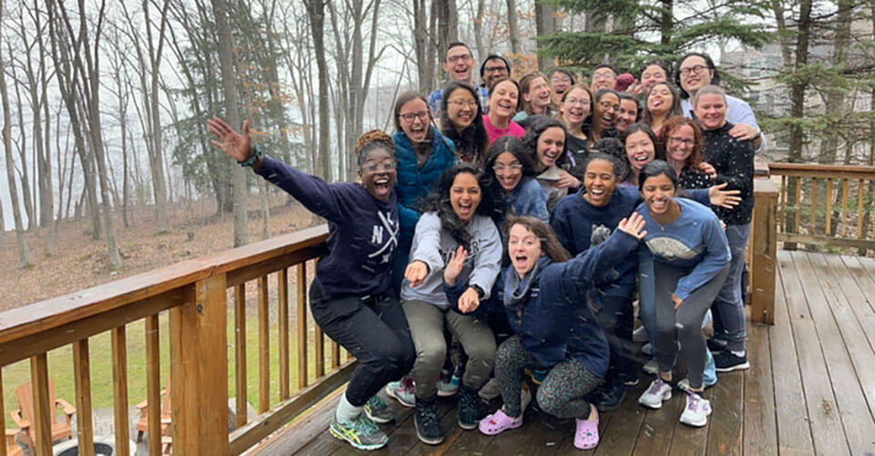 Pediatric residents standing outside on a deck