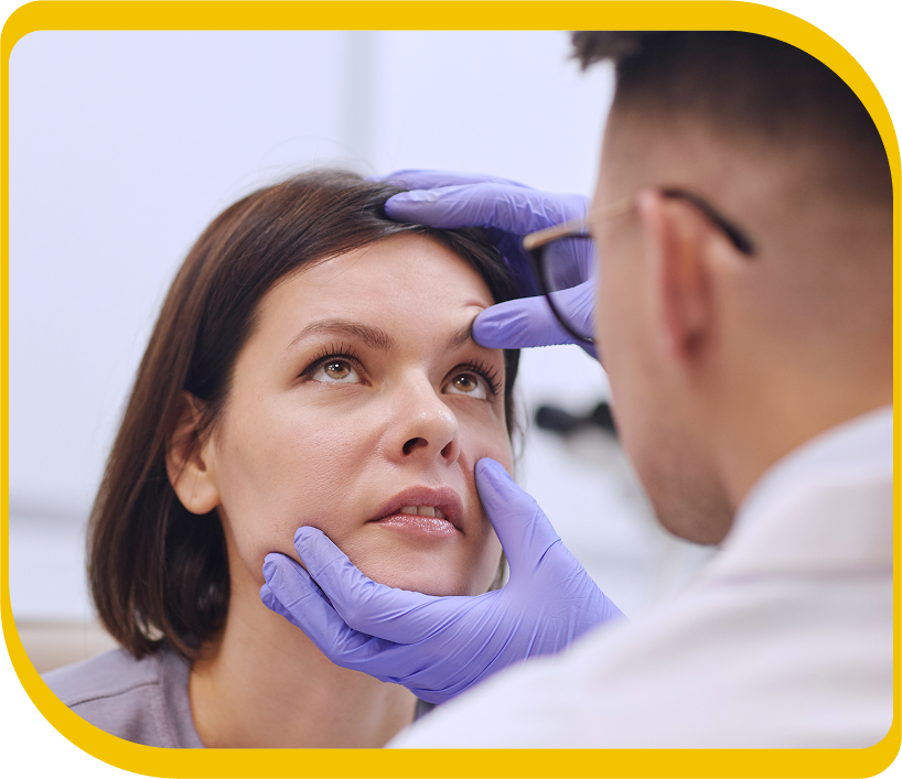 Doctor checking a woman's eye