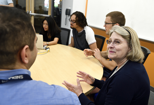 Faculty speaking with graduate students