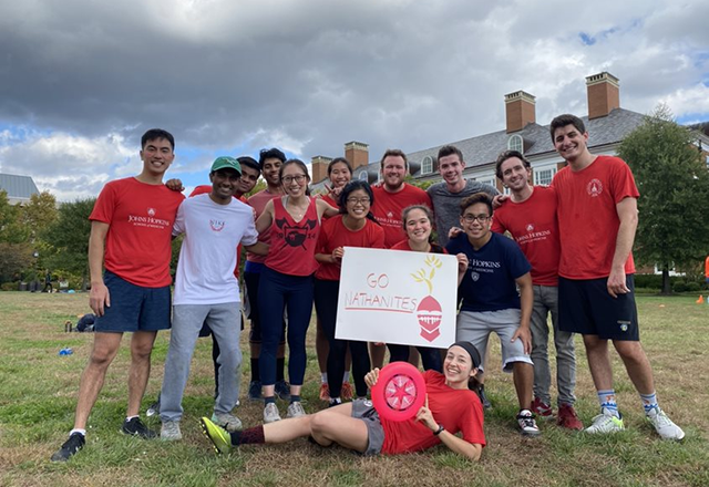 college olympics students posing in field