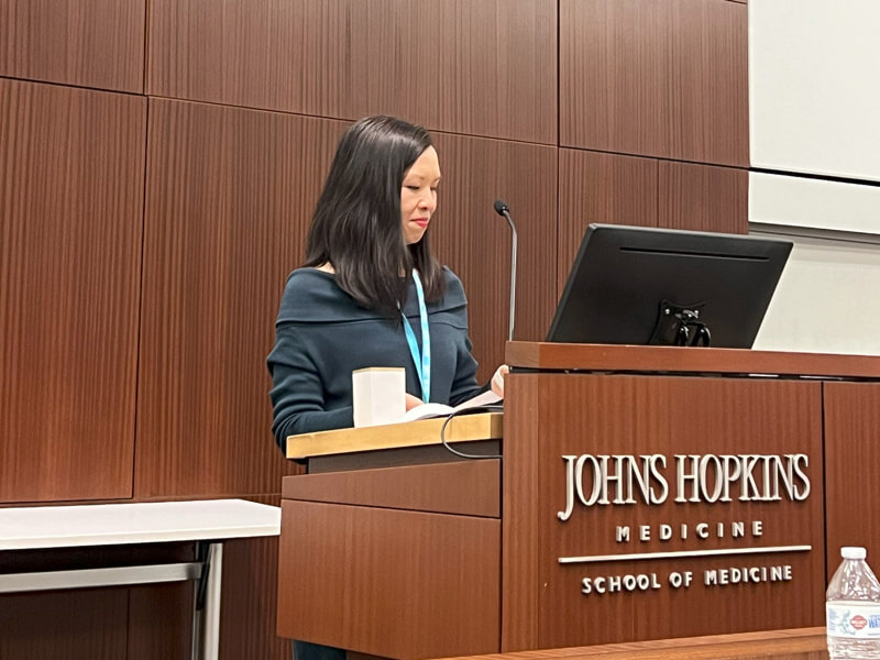 Dr. Katherine Chretien speaks at the podium