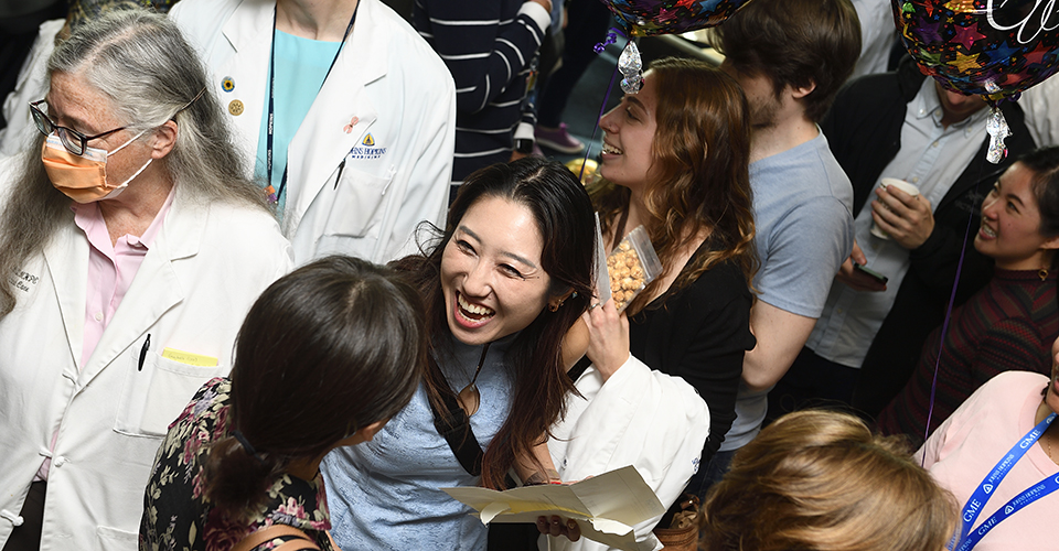 Students excitedly open match day envelopes