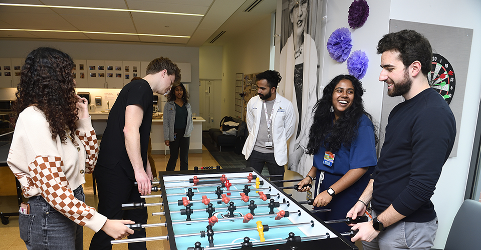 Students playing foosball in the common rooms
