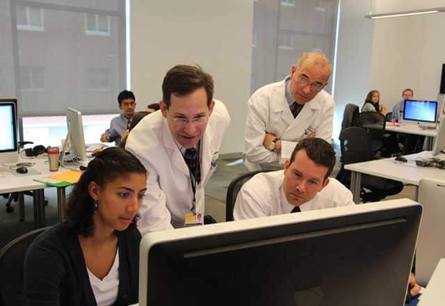 Faculty and students in the computer lab