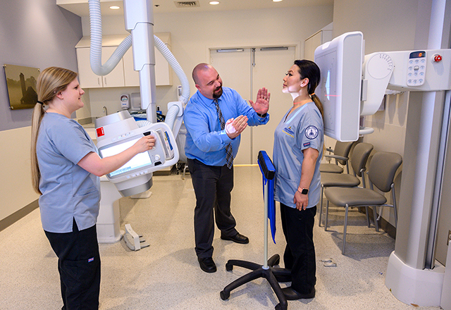 A medical imaging faculty member and students