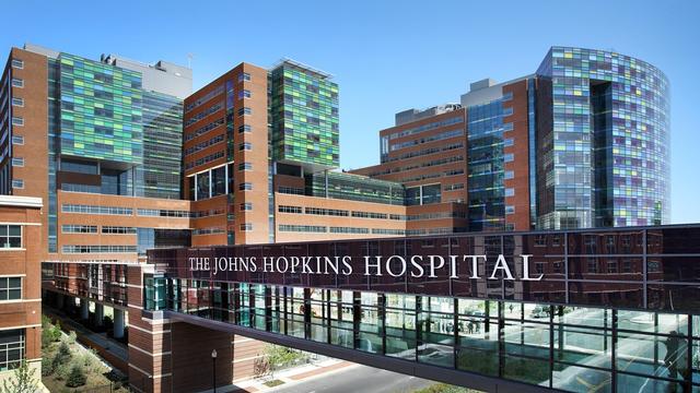 A wide shot of the exterior of the main Johns Hopkins Hospital East Baltimore campus