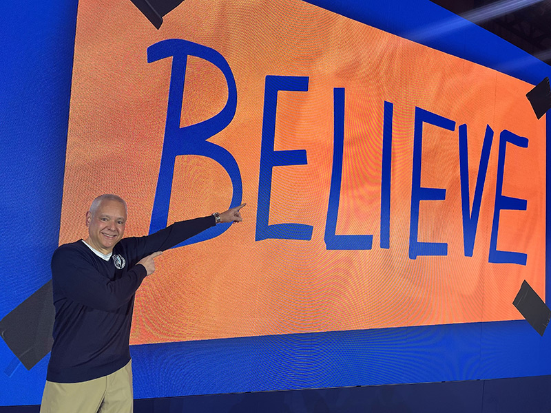 Chris Jones pointing to the Believe sign from Ted Lasso