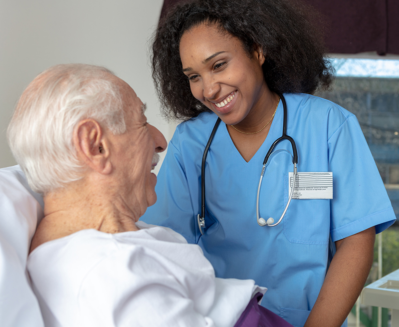 nurse smiling at patient  - make a gift surgery