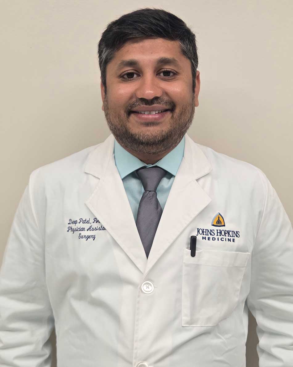 Deep Patel in a white coat