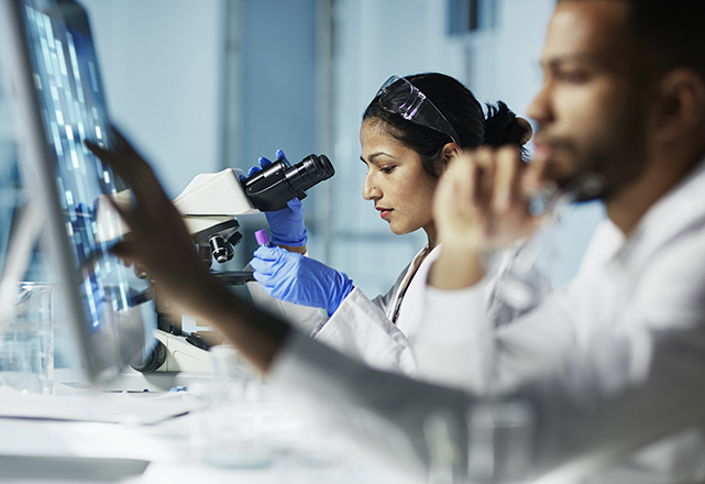 endocrine surgery - female researcher looking into 