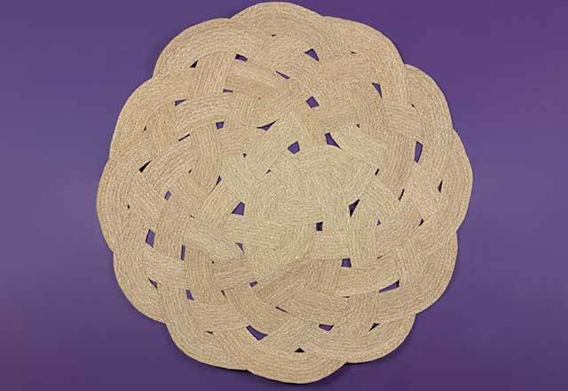 Photo showing artwork of braided sea grass in a woven pattern