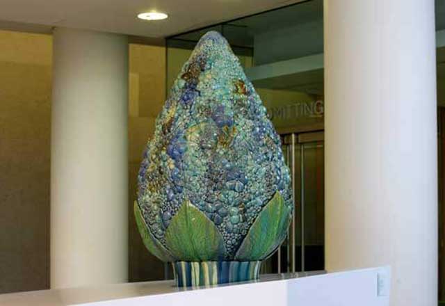 Sculpture of a large flower with colored glass.