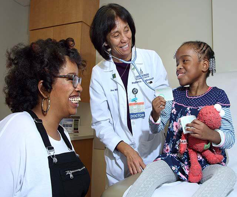Chloe with her mother Jarilyn, and pediatric nephrologist Alicia Neu