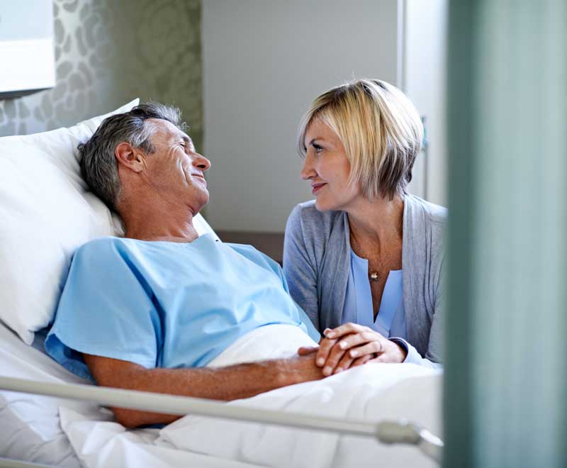 Older couple holding hands