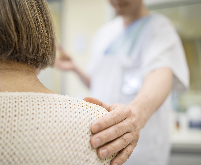 reconstructive transplant - doctor placing hand on patient's shoulder