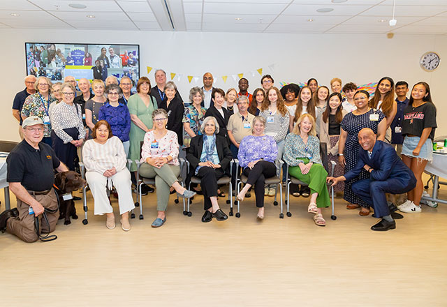 Volunteer group sitting together for a photo