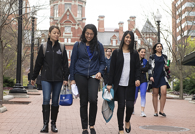 students walking along the campus of Johns Hopkins University
