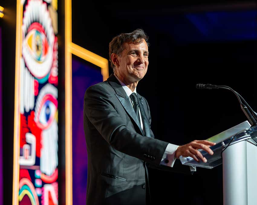 Ronald J. Daniels speaking at a podium