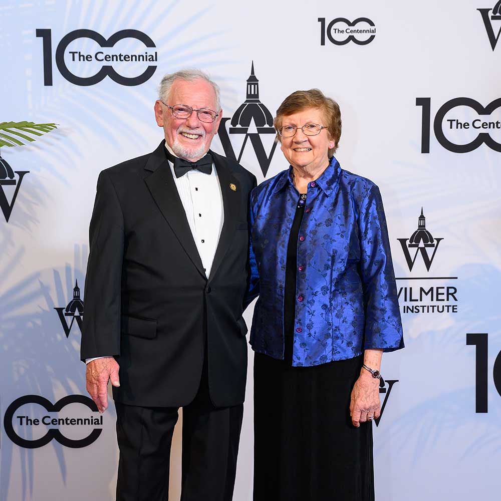 Ted and his wife Ann smiling together at the Wilmer centennial celebration