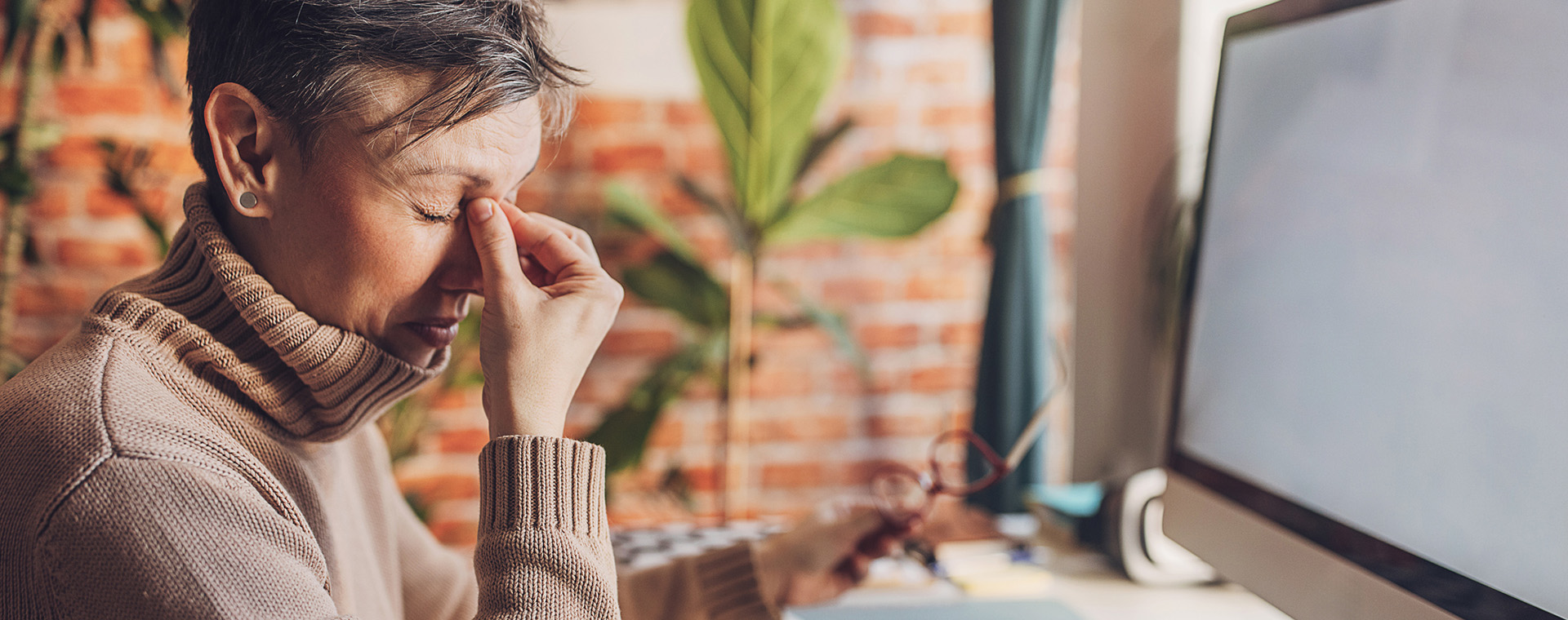 a woman holding her eyes because they are dry