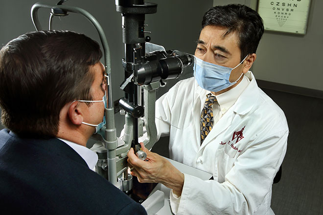 Dr. Neil Bressler looks at image of patient retina