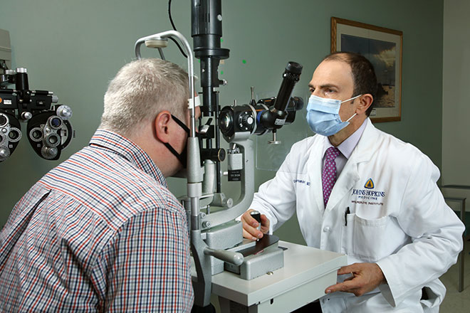 Dr. Eric Singman performing eye test 