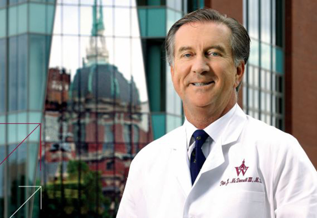 Peter McDonnell stands in front of the Wilmer Eye Institute Smith building
