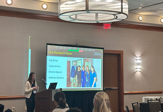Hailey Ahrens from Vitreo Retinal Associates presenting to the conference.
