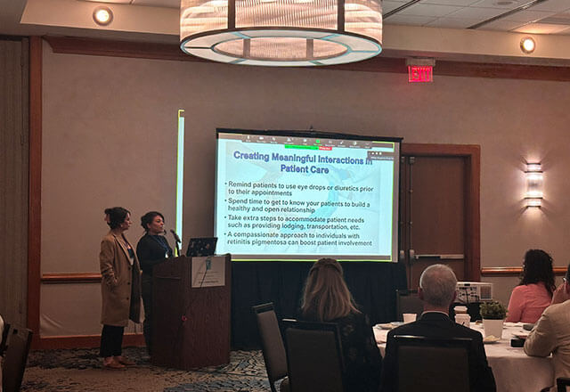 Mariana Edwards and Kimberly Rodriguez presenting to the conference. 