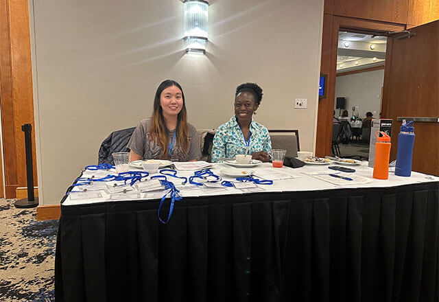 NAC Attack Staff at the registration table for the conference