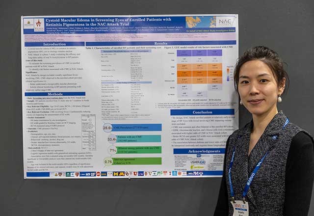 Researcher standing in front of her research poster
