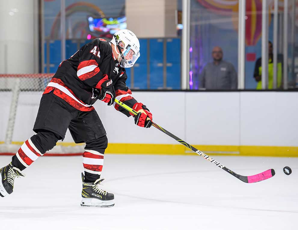 Brian makes a shot on the ice
