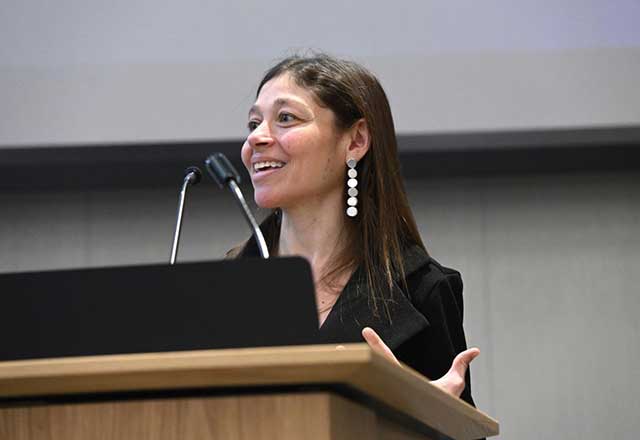 Jamie Spangler speaking at a podium