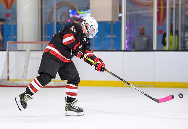 Hockey player shoots a puck