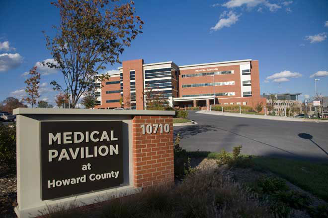 Sign in front of brick medical office that reads medical pavilion at Howard County
