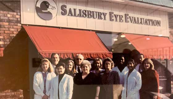 Team photo in front of the Salisbury Eye Evaluation sign