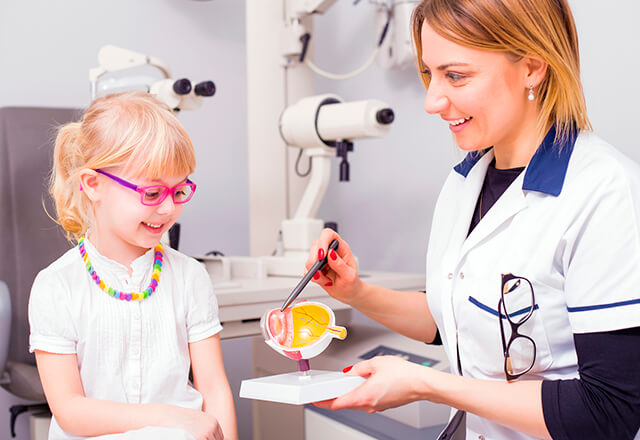 eye doctor performing fun optical test with child