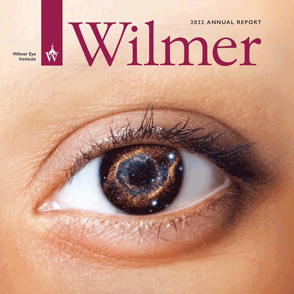 Annual report 2022 cover showing an eye up close with a galaxy reflected in the iris.